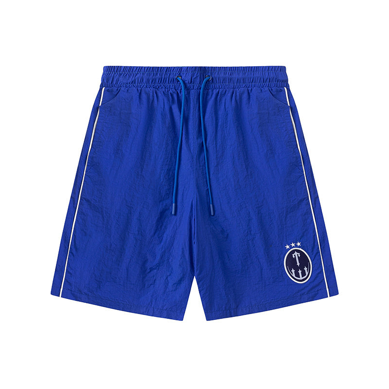 Blue and khaki drawstring casual shorts with elastic waist, side pockets, contrast piping, and small leg emblem - view 2