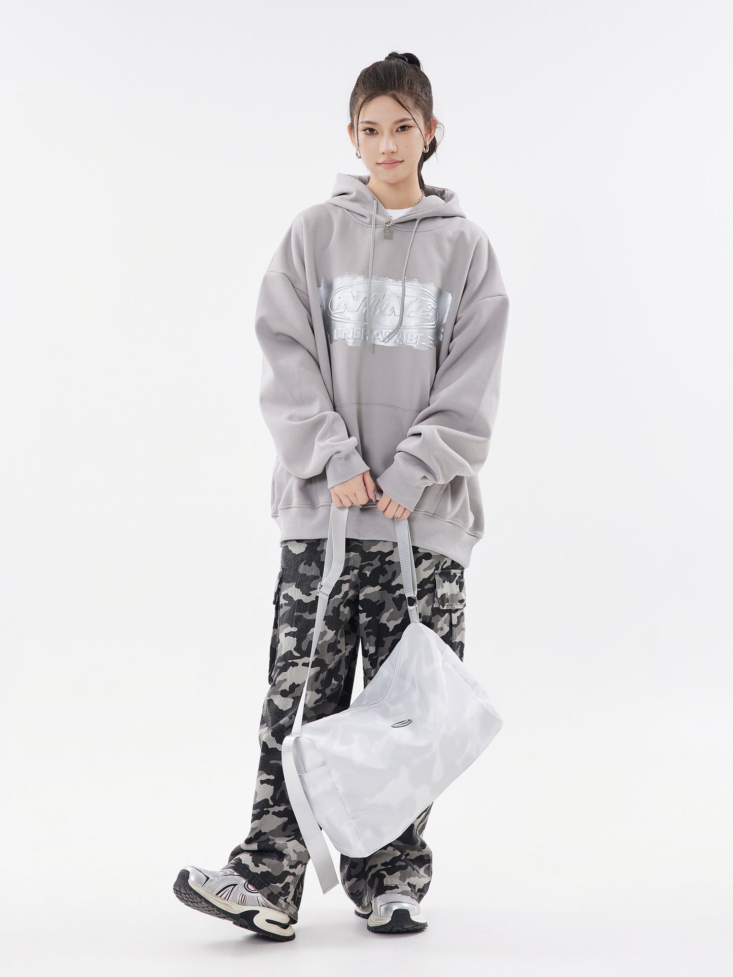 Cement grey hoodie front view with bag