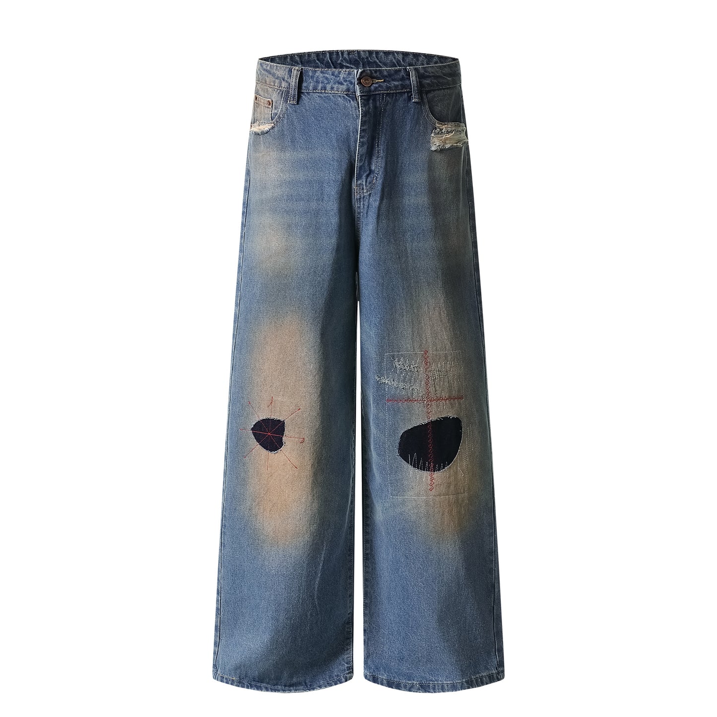 Distressed patch jeans back view with mud dye fading
