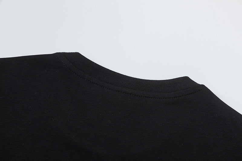 Black short-sleeve crewneck T-shirt with yellow and white graffiti-style graphic print - view 3