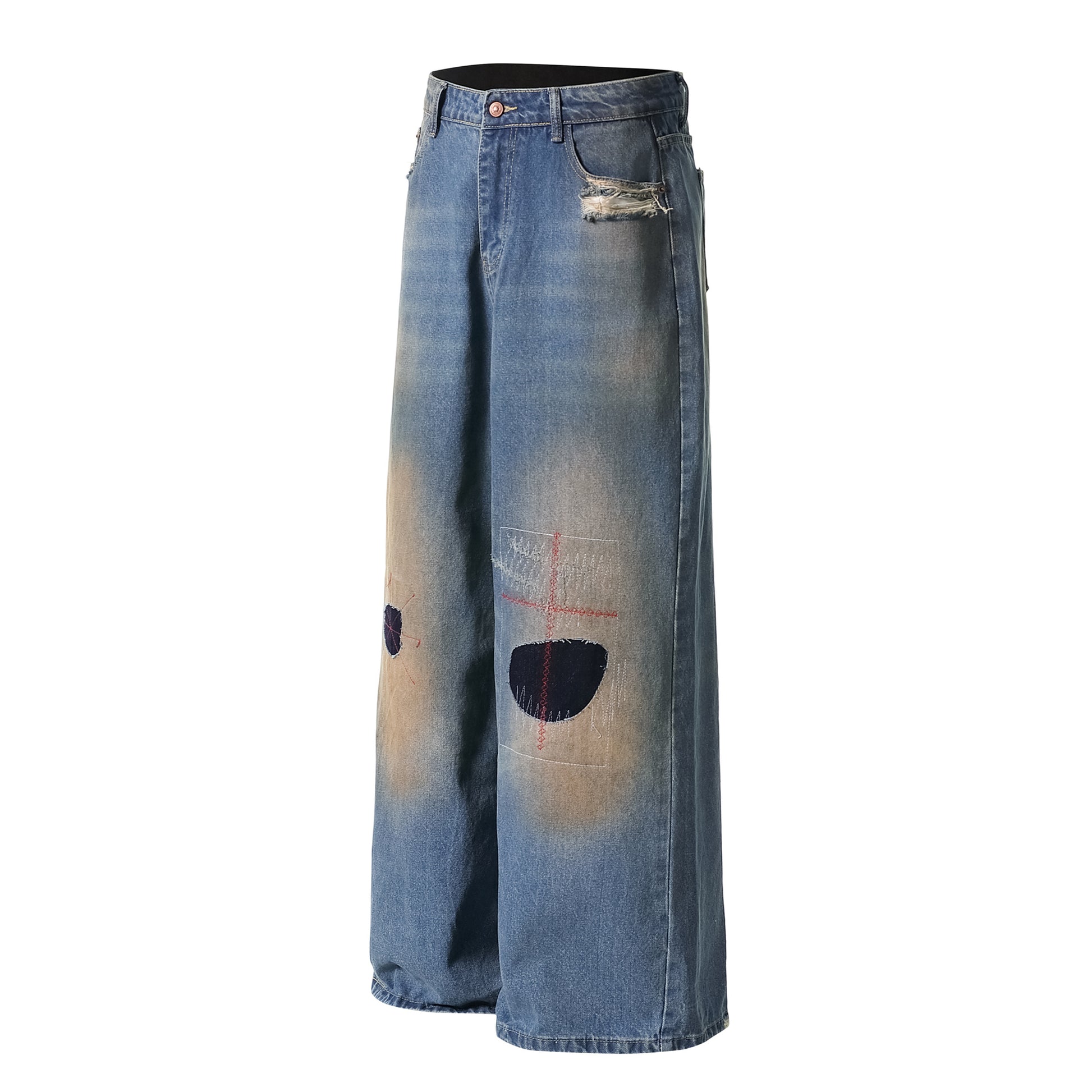 Distressed patch jeans front view close-up