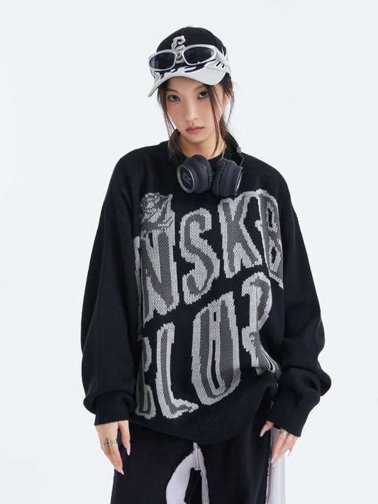 Black UNS Club sweater front model view with headphones