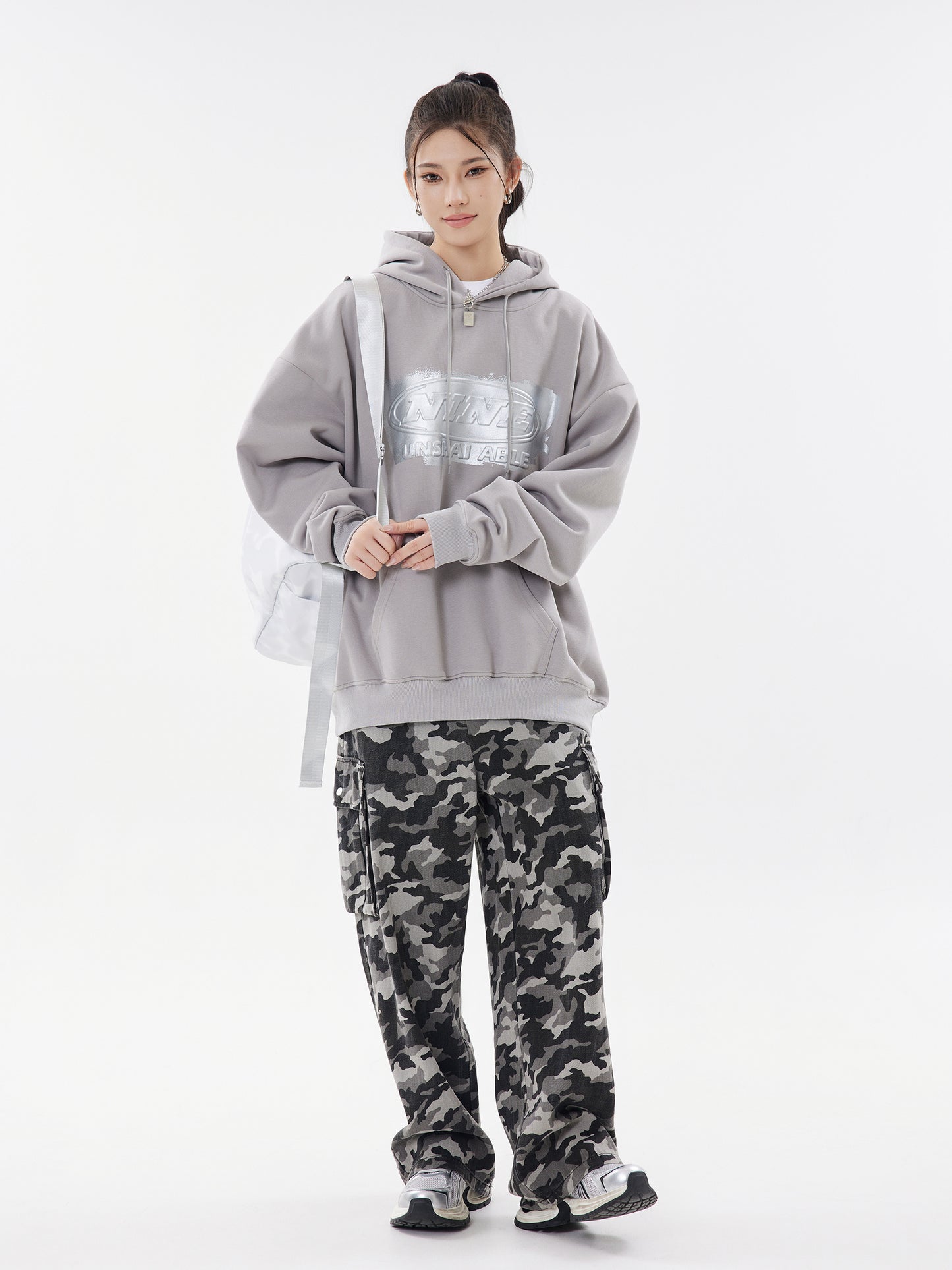 Cement grey hoodie side view with bag