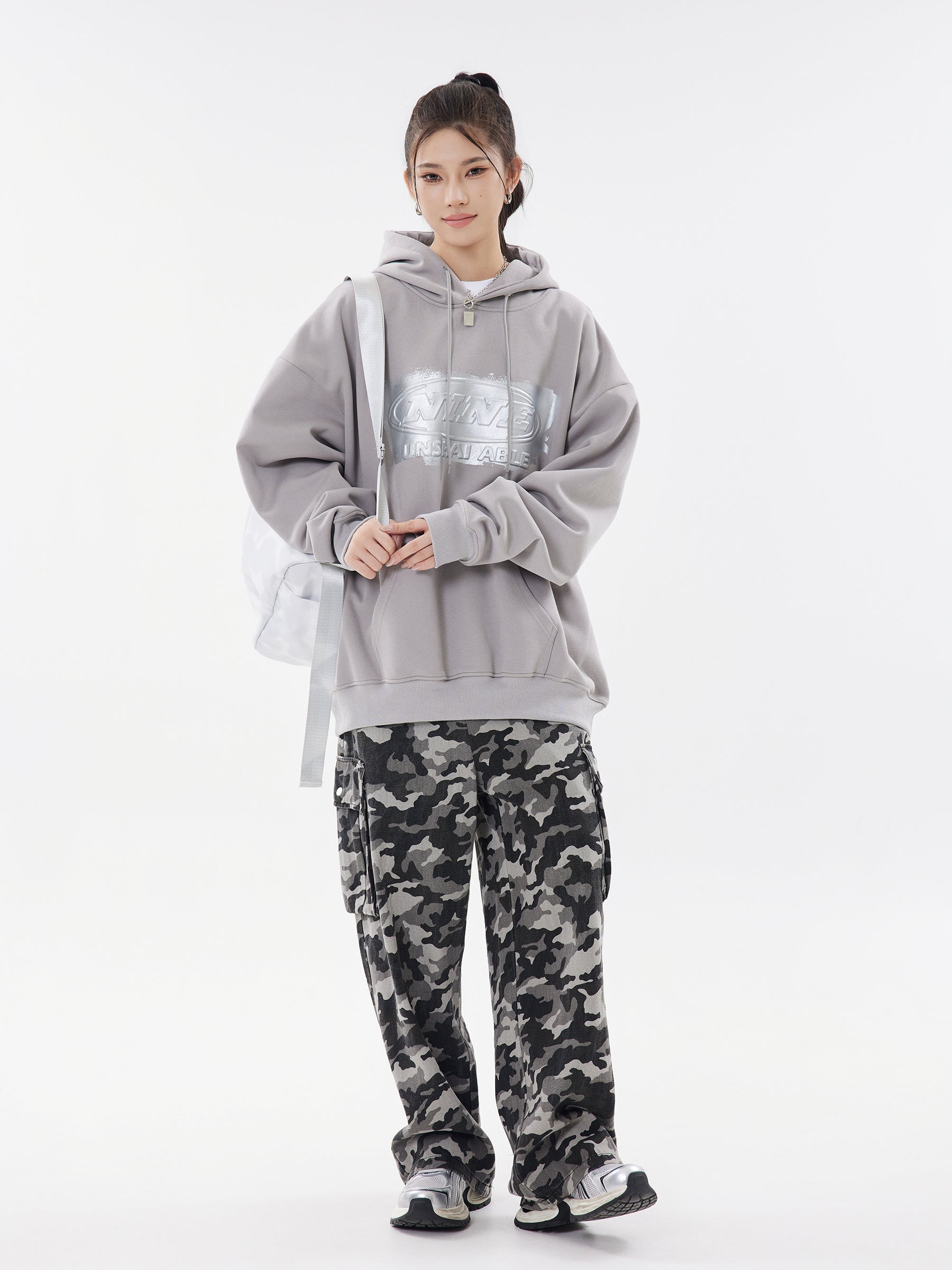 Cement grey hoodie side view with bag
