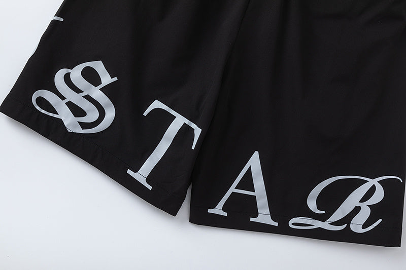 Black unisex drawstring shorts with blue letter graphic, elastic waistband, and side pockets - view 4
