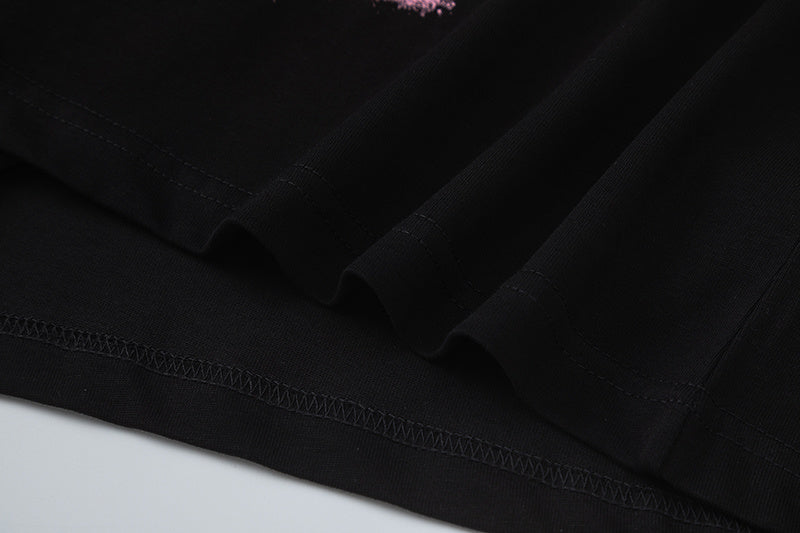 Black short sleeve graphic T-shirt with pink graffiti-style skull print - view 4