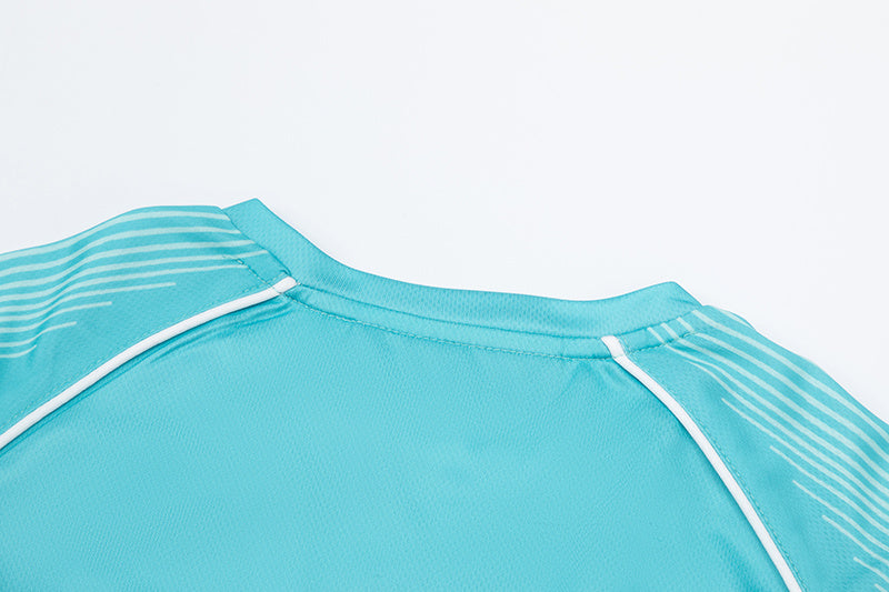 Turquoise Trapstar graphic football jersey with KidSuper Studios artwork and contrast striped panels - view 5
