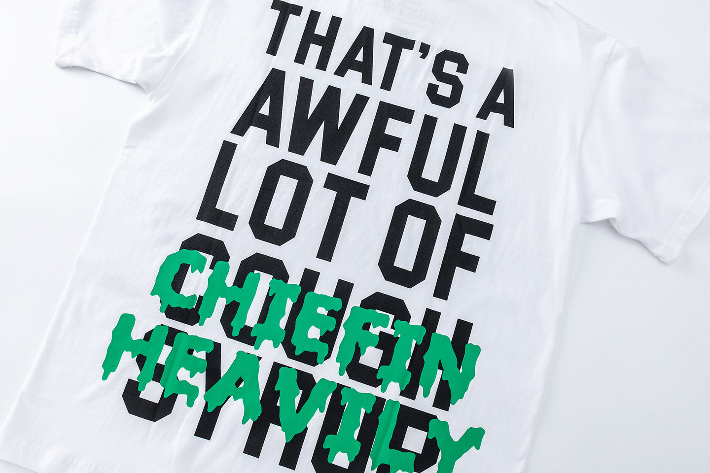 Black and white unisex graphic T-shirts with bold green Chiefln Heavy lettering and cartoon artwork - view 5
