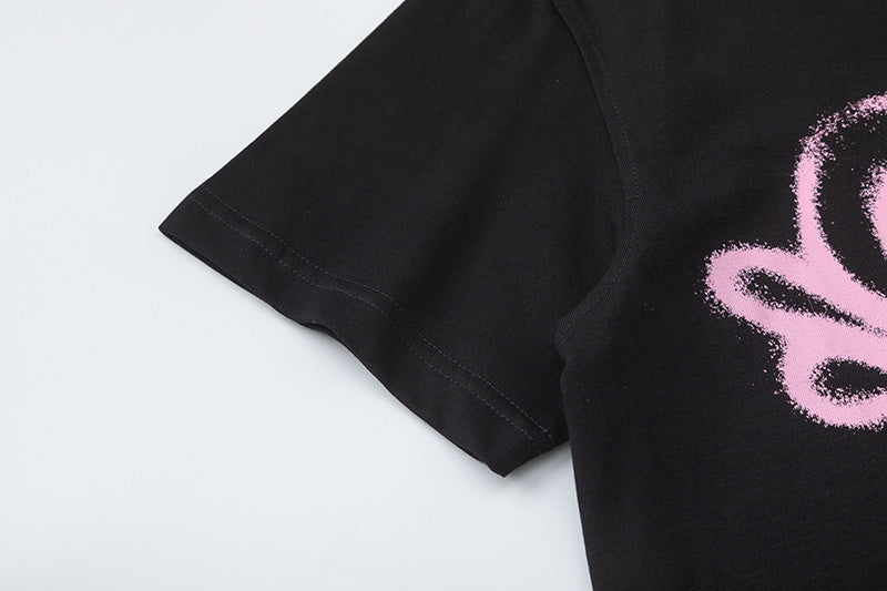 Black short sleeve graphic T-shirt with pink graffiti-style skull print - view 5