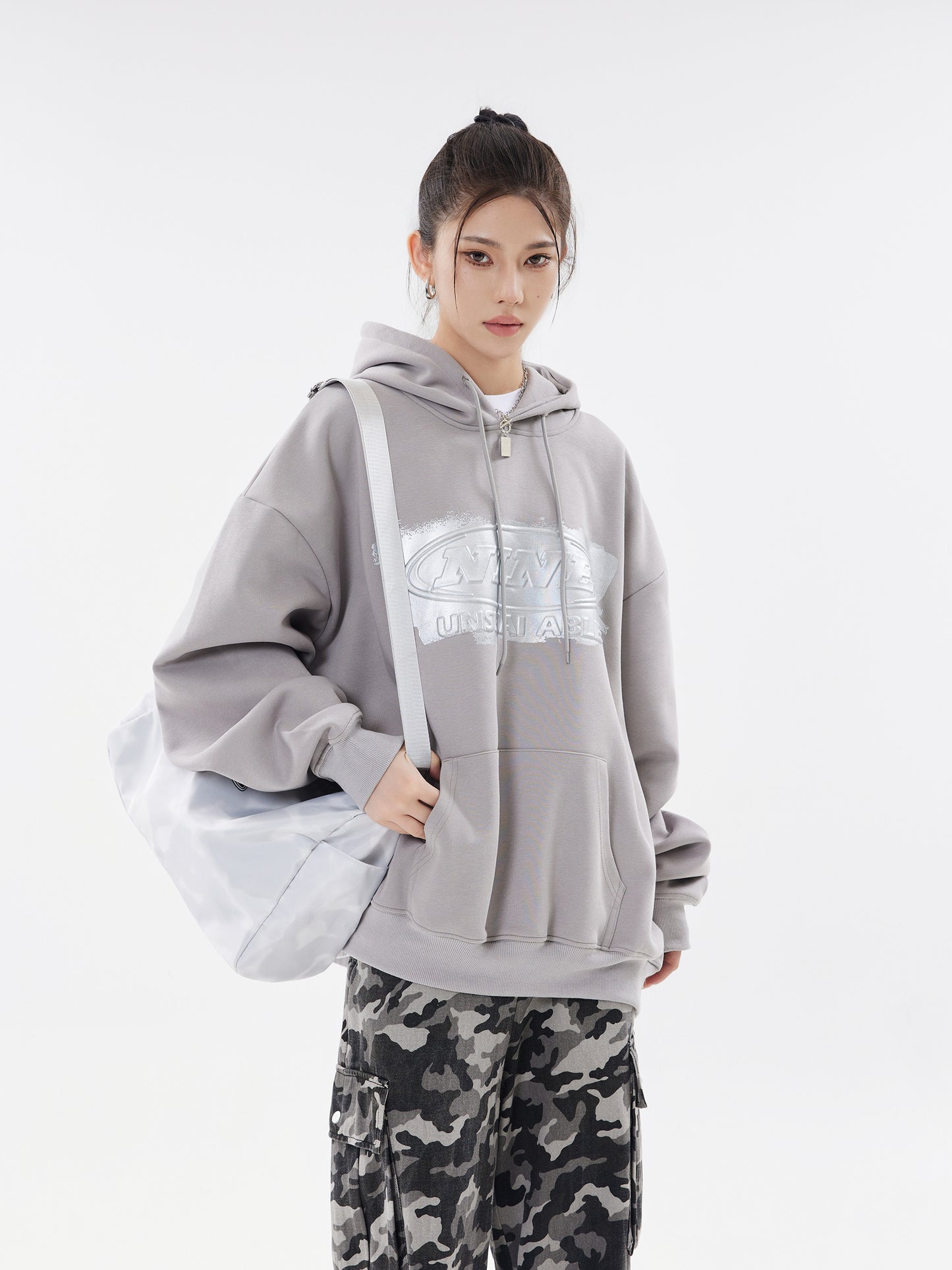 Cement grey hoodie front view with shoulder bag