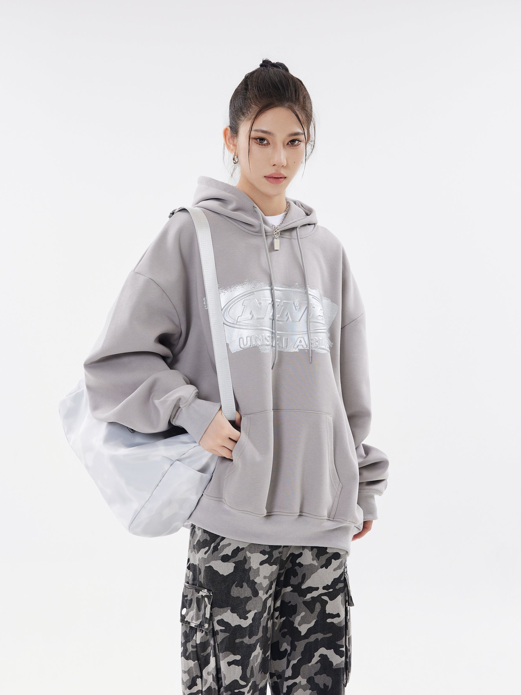 Cement grey hoodie front view with shoulder bag