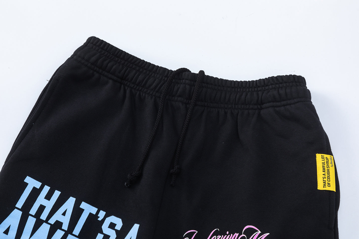 Men's black graphic shorts with light blue lettering, bottle-and-wings print, drawstring waist, and rear patch pocke - view 5
