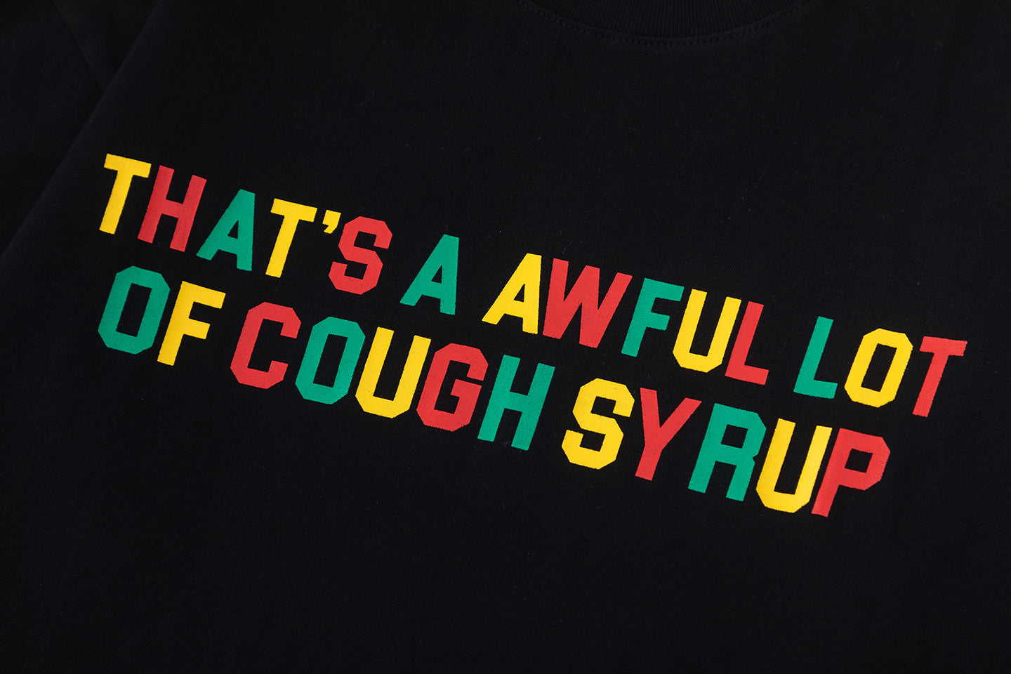Black oversized unisex graphic T-shirt with colorful Cough Syrup text print - view 6