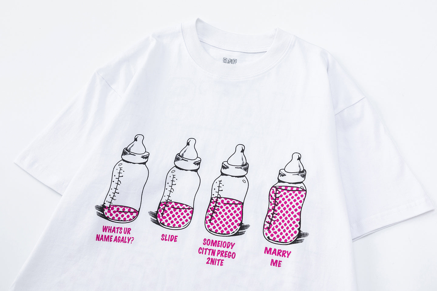 White crew neck graphic T-shirt with baby bottle artwork and pink polka dot text - view 6