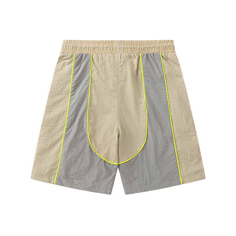 Blue and khaki drawstring casual shorts with elastic waist, side pockets, contrast piping, and small leg emblem - view 6