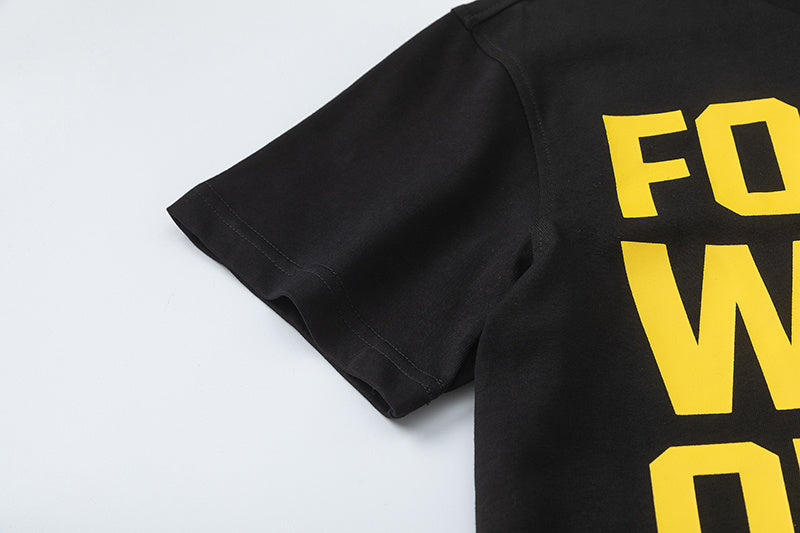 Black crewneck short sleeve T-shirt with yellow text graphic and white graffiti-style chest artwork - view 6