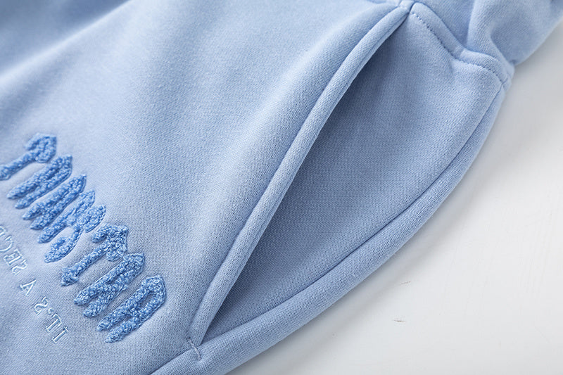 Light blue Trapstar graphic hoodie and matching joggers tracksuit set with drawstrings and zip hems - view 6