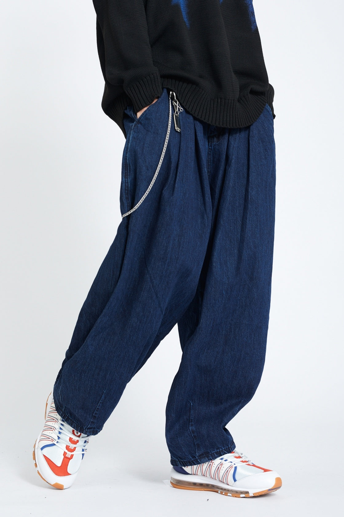 Dark indigo denim jogger side view with chain detail