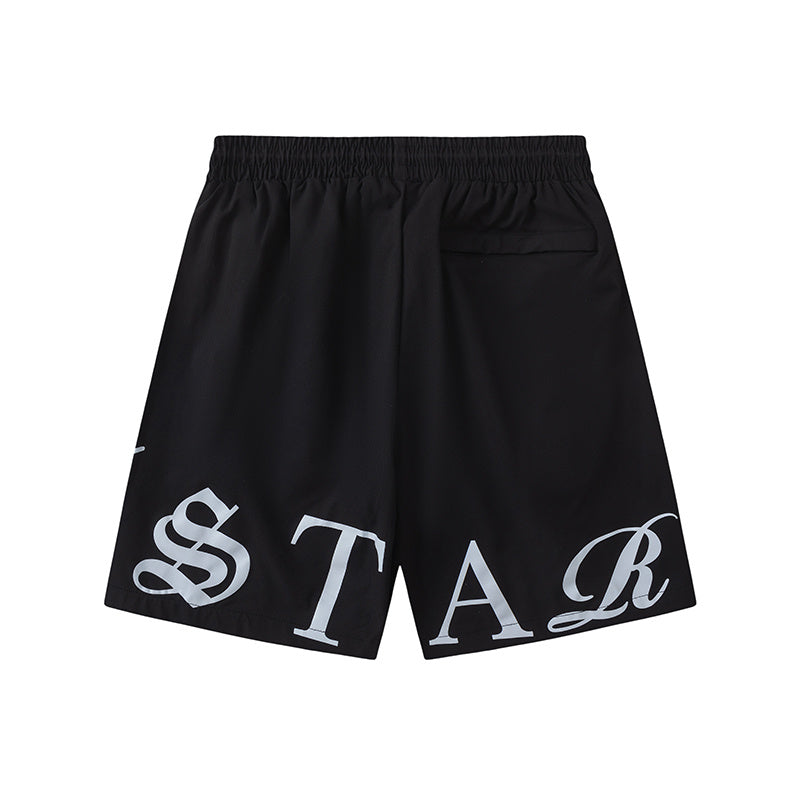 Black unisex drawstring shorts with blue letter graphic, elastic waistband, and side pockets - view 7
