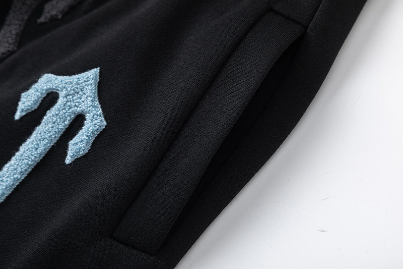 Black Trapstar graphic pullover hoodie and jogger pants two-piece tracksuit set with blue, white and gray lettering - view 7