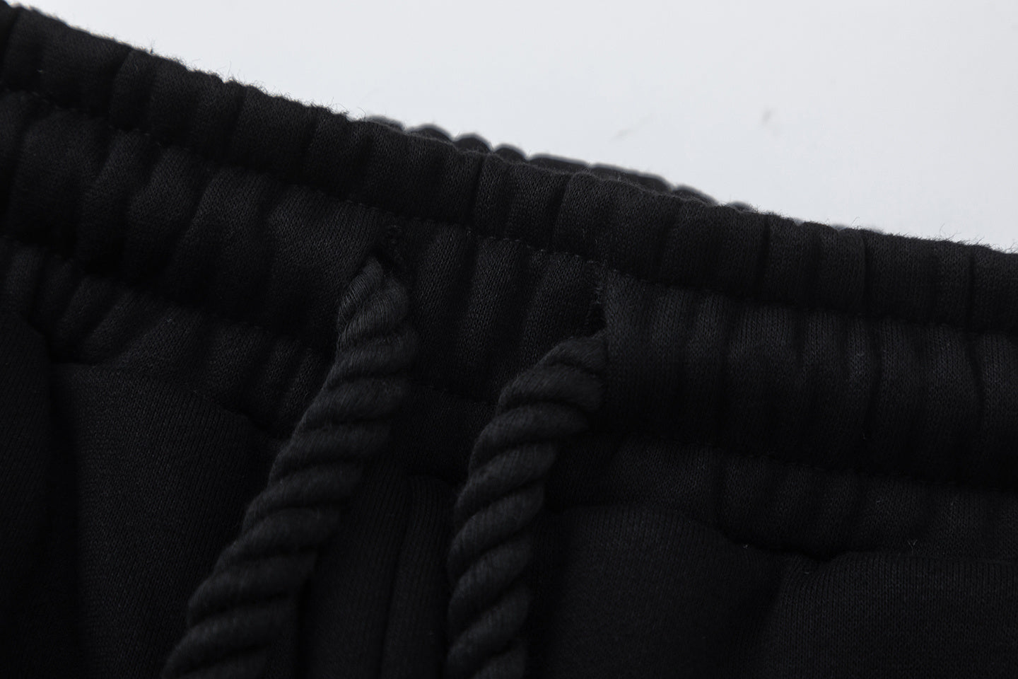 Black hooded sweatshirt and tapered jogger pants set with a graffiti-style hood graphic - view 7