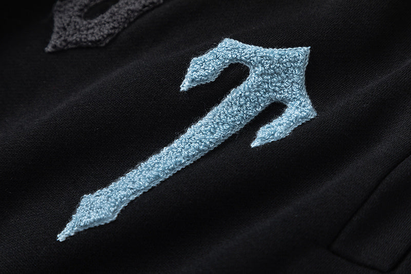Black Trapstar graphic pullover hoodie and jogger pants two-piece tracksuit set with blue, white and gray lettering - view 8