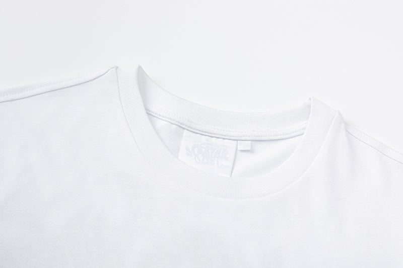 White crew neck graphic T-shirt with small green chest graphic and large graffiti-style back print - view 9