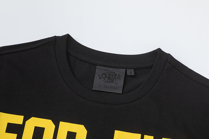 Black crewneck short sleeve T-shirt with yellow text graphic and white graffiti-style chest artwork - view 9