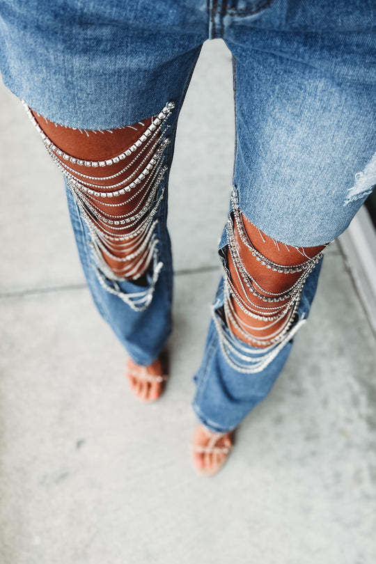 Early spring jeans with big holes for women, straight pants with chain ornaments