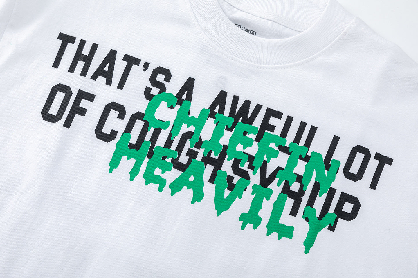 Black and white unisex graphic T-shirts with bold green Chiefln Heavy lettering and cartoon artwork - view 10