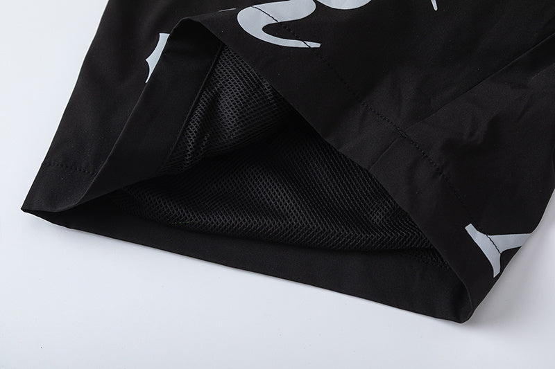 Black unisex drawstring shorts with blue letter graphic, elastic waistband, and side pockets - view 10