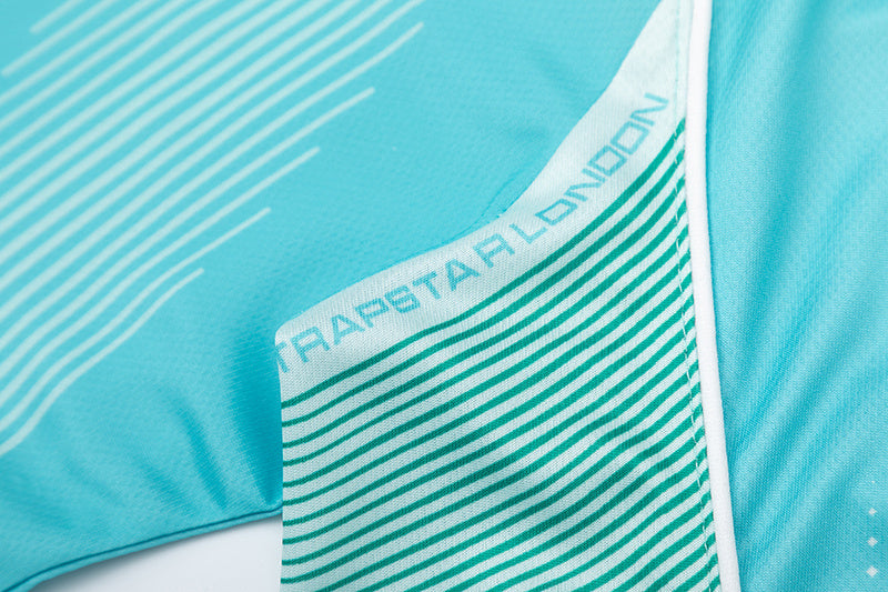 Turquoise Trapstar graphic football jersey with KidSuper Studios artwork and contrast striped panels - view 11