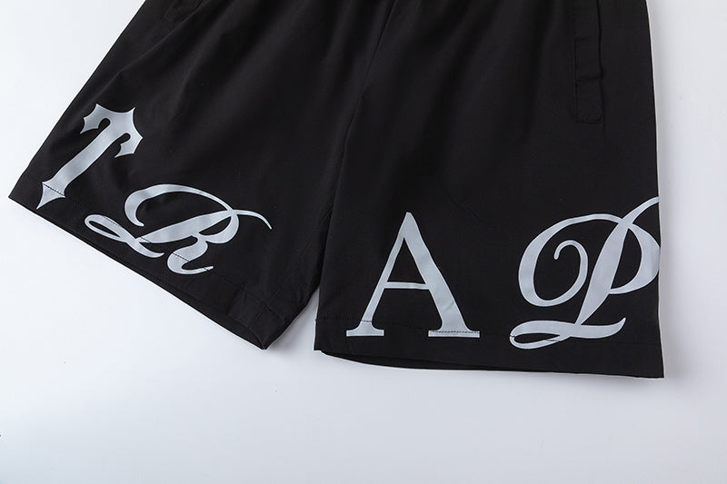 Black unisex drawstring shorts with blue letter graphic, elastic waistband, and side pockets - view 11