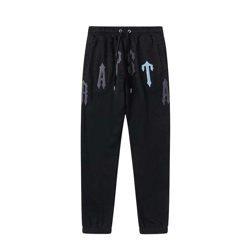 Black Trapstar graphic pullover hoodie and jogger pants two-piece tracksuit set with blue, white and gray lettering - view 11