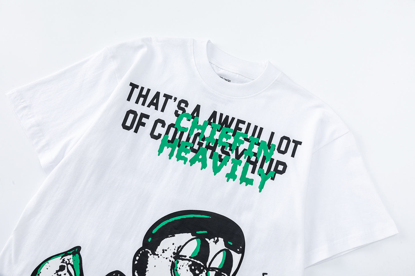 Black and white unisex graphic T-shirts with bold green Chiefln Heavy lettering and cartoon artwork - view 12