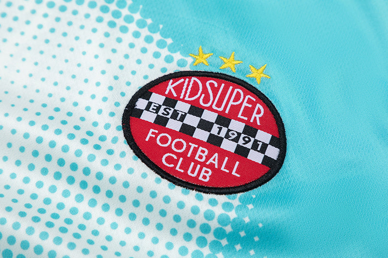 Turquoise Trapstar graphic football jersey with KidSuper Studios artwork and contrast striped panels - view 12