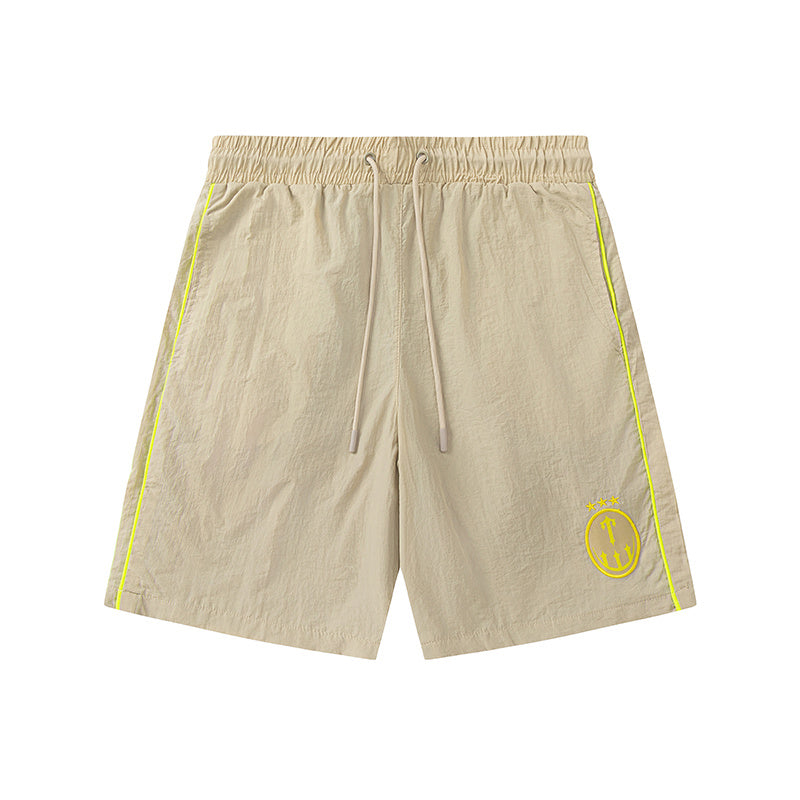 Blue and khaki drawstring casual shorts with elastic waist, side pockets, contrast piping, and small leg emblem - view 13