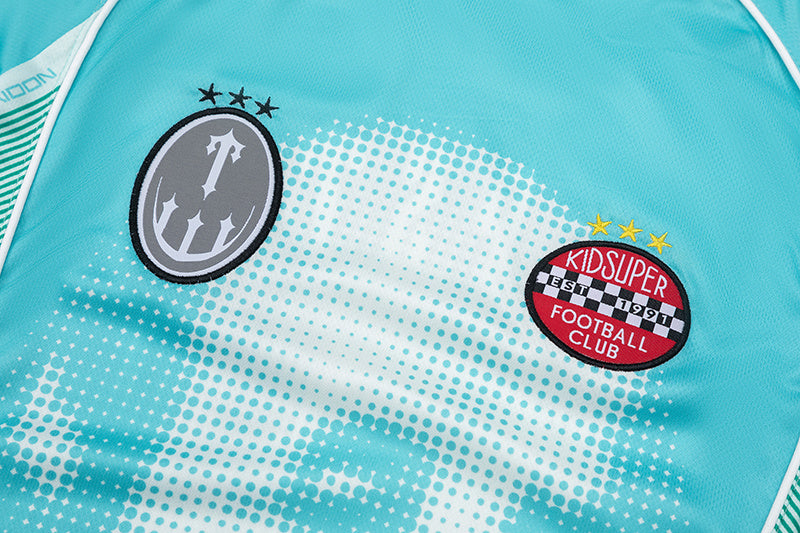 Turquoise Trapstar graphic football jersey with KidSuper Studios artwork and contrast striped panels - view 14