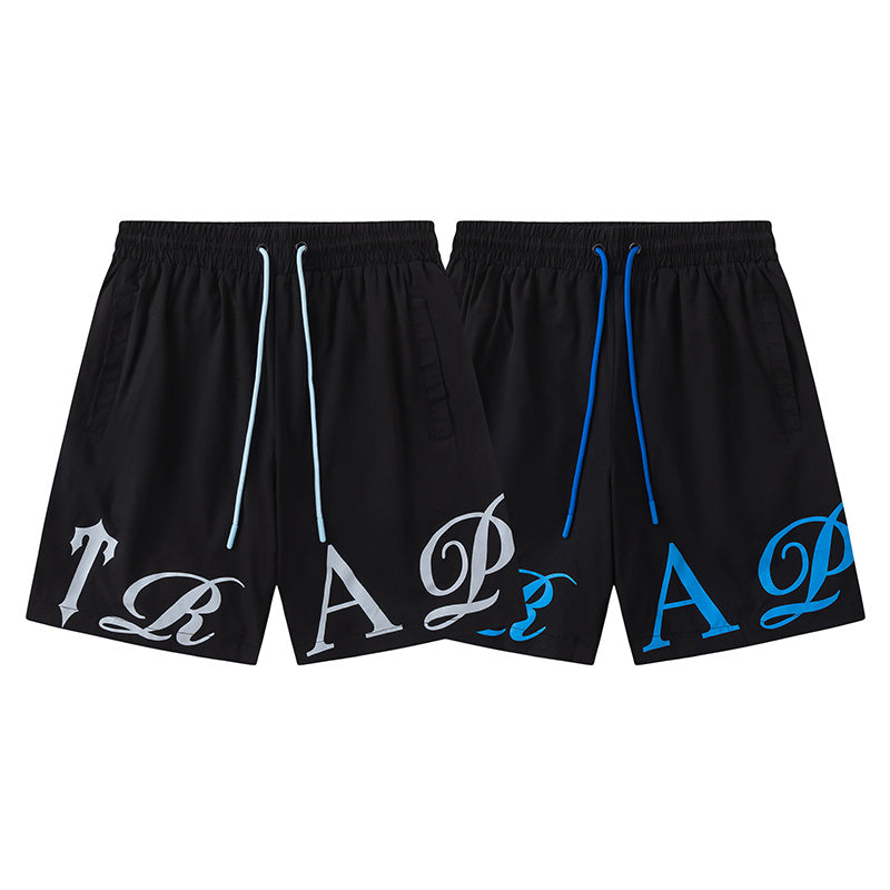 Black unisex drawstring shorts with blue letter graphic, elastic waistband, and side pockets - view 16