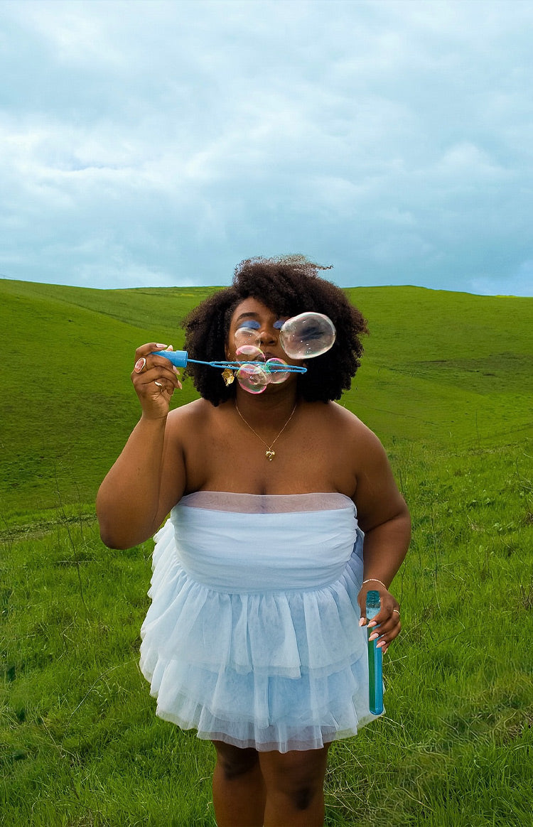 Blue strapless ruffled mini dress.