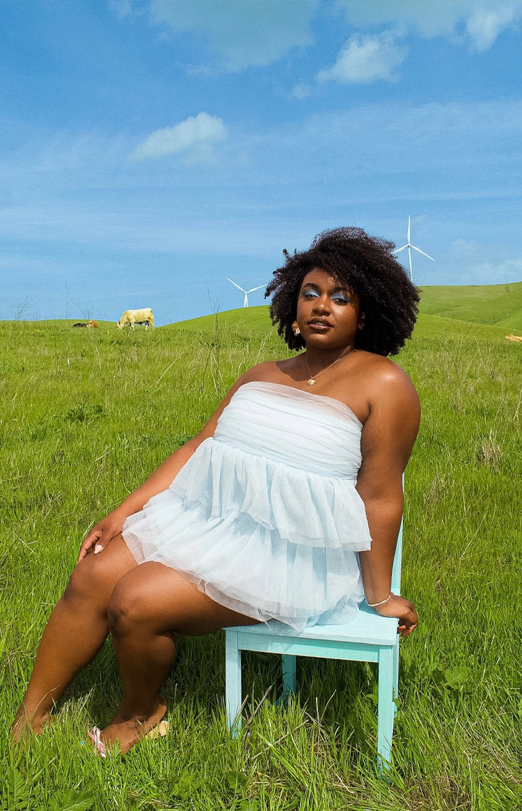 Blue strapless ruffled mini dress.