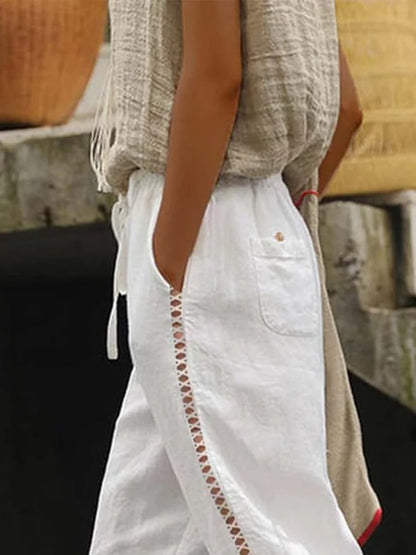 Lockere lässige Hose aus Leinen mit Hohlschnitten, Spitze, Taschen und Kordelzug in der Taille