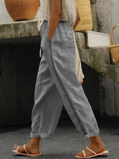 Lockere lässige Hose aus Leinen mit Hohlschnitten, Spitze, Taschen und Kordelzug in der Taille
