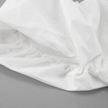 Robe blanche à manches bouffantes, col en V et laçage