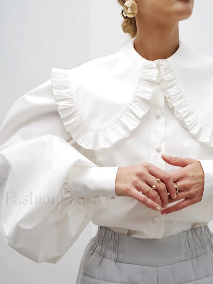 Bluse mit Rüschenkragen und langen Ärmeln