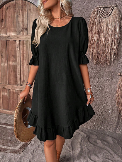 Robe smockée unie à manches bouffantes et ourlet volanté