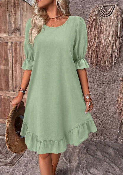 Robe smockée unie à manches bouffantes et ourlet volanté