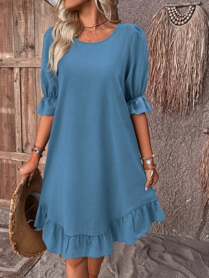 Robe smockée unie à manches bouffantes et ourlet volanté