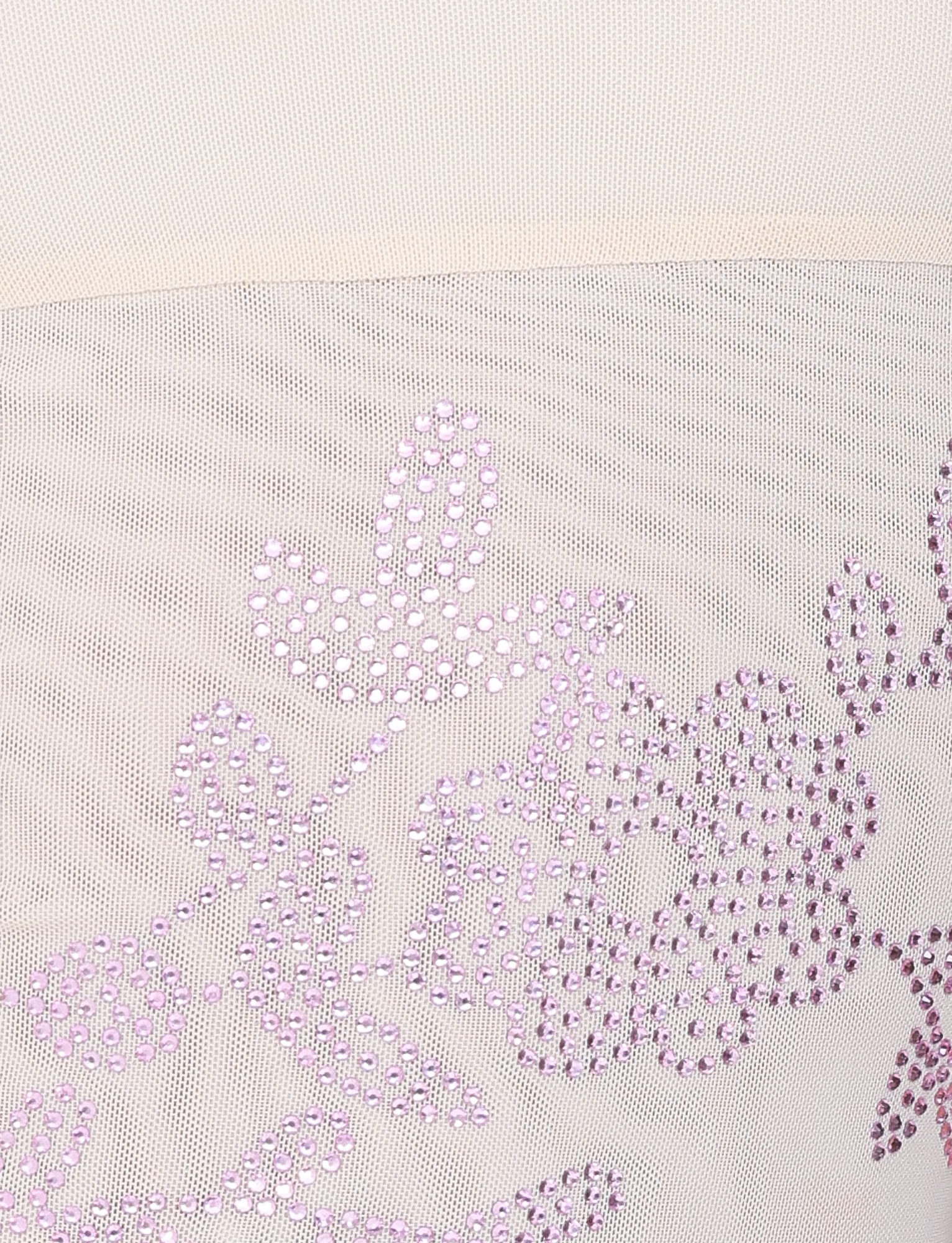 Close-up of the OCTAVIA TOP - NEUTRAL : CREAM by TIGERMIST, featuring sheer white mesh with light purple sequin floral and leaf patterns for a delicate, decorative look.