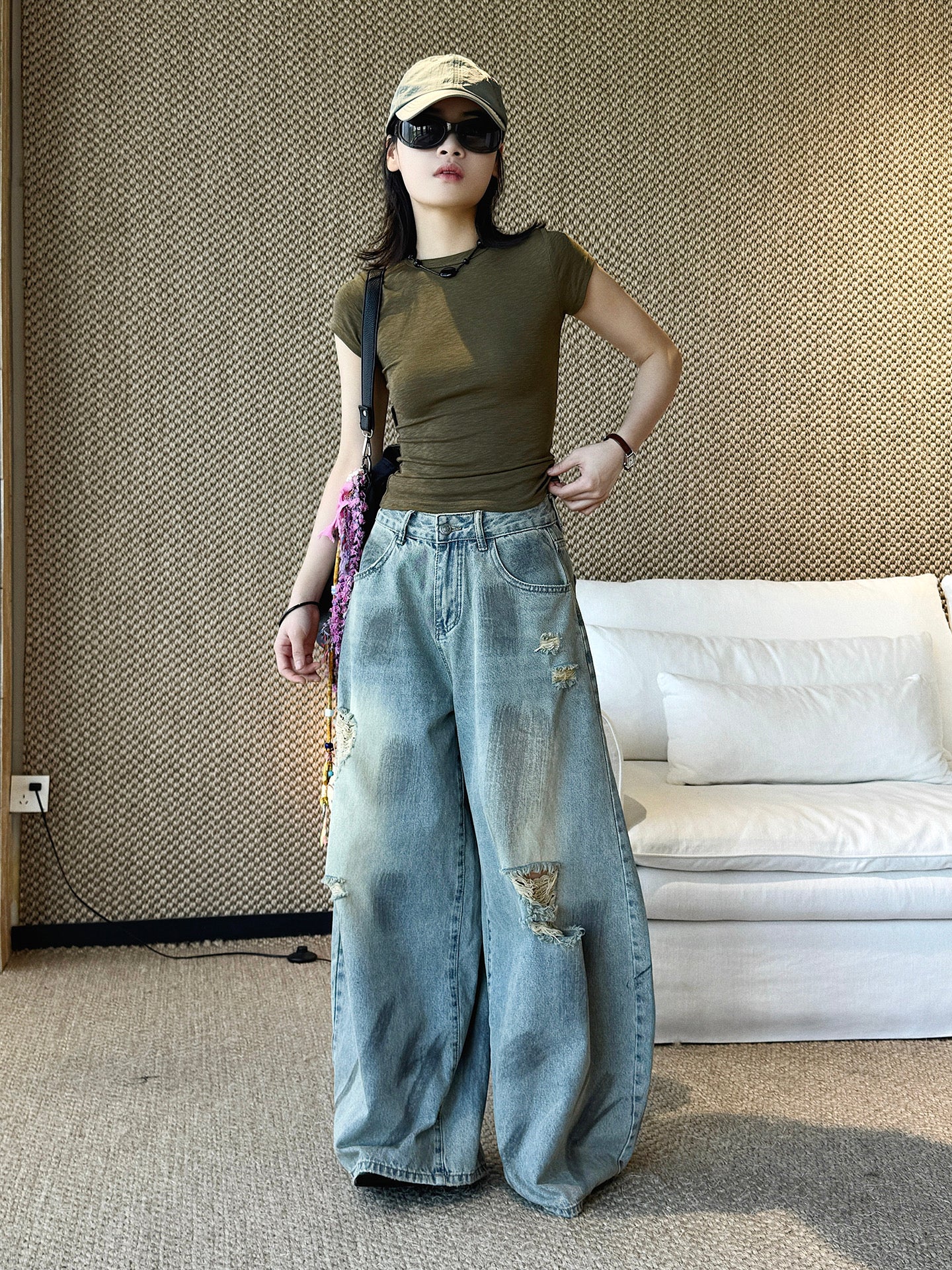 Women's ripped wide leg baggy jeans front view